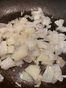 Translucent onions in pan