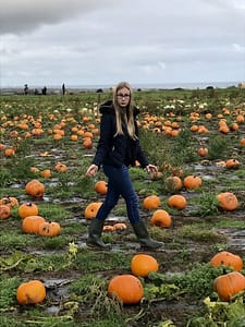 chloe in pumpkin field scaled