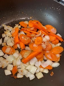 Carrots And Onions In A Frying Pan
