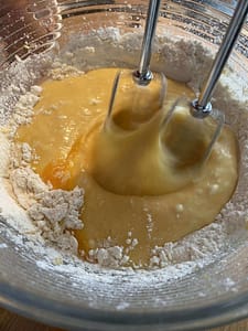 Whisk Flour And Eggs To Form A Thick Batter