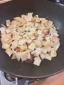 Cabbage Onion And Bacon In Frying Pan