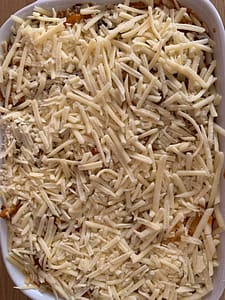 Grated Cheese On Potato Bake
