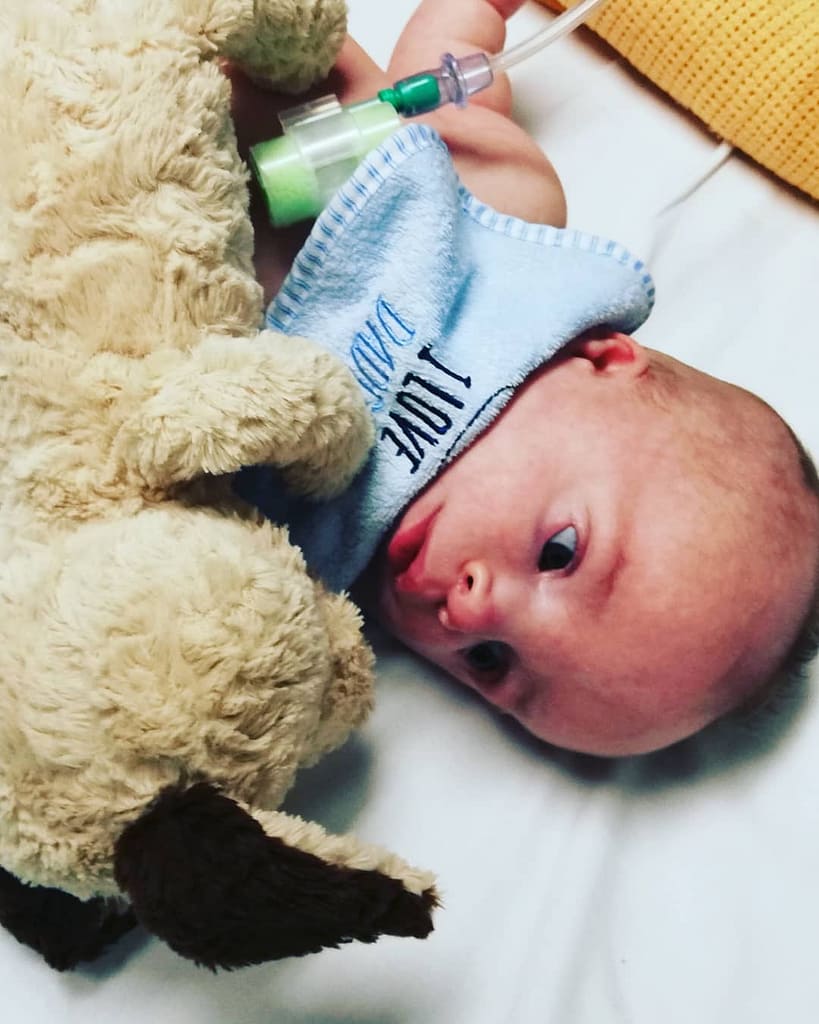 Baby Jack Laying With Teddy